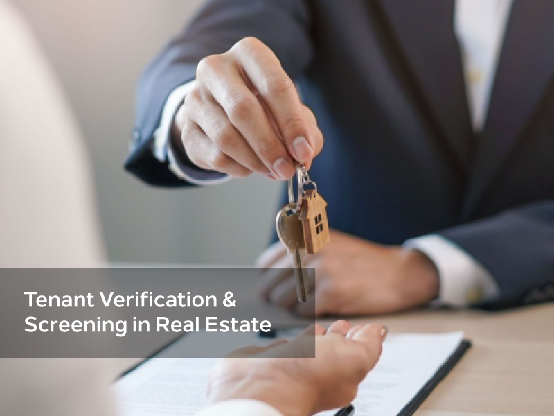 Handing over house keys during tenant verification process in real estate.